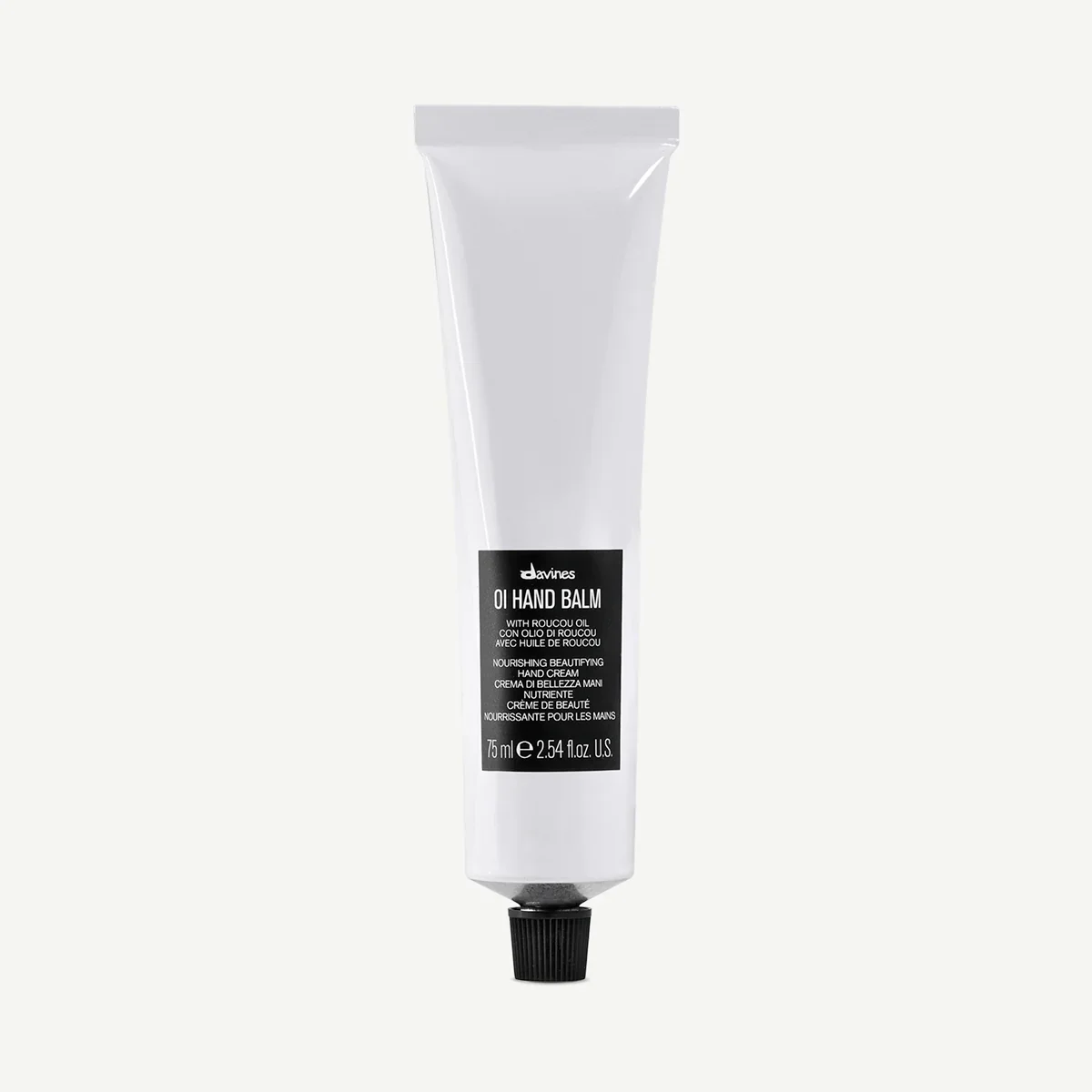 A tube of Davines oil hand balm with Roucou oil, featuring black and white packaging.