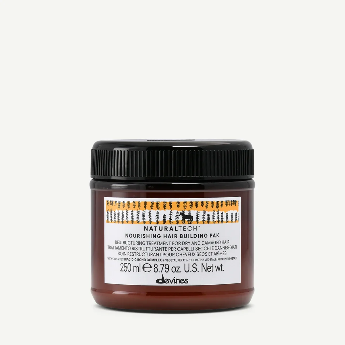 A jar of Davines NaturalTech Nourishing Hair Building Pak with black lid, brown container, and white label on a white background.