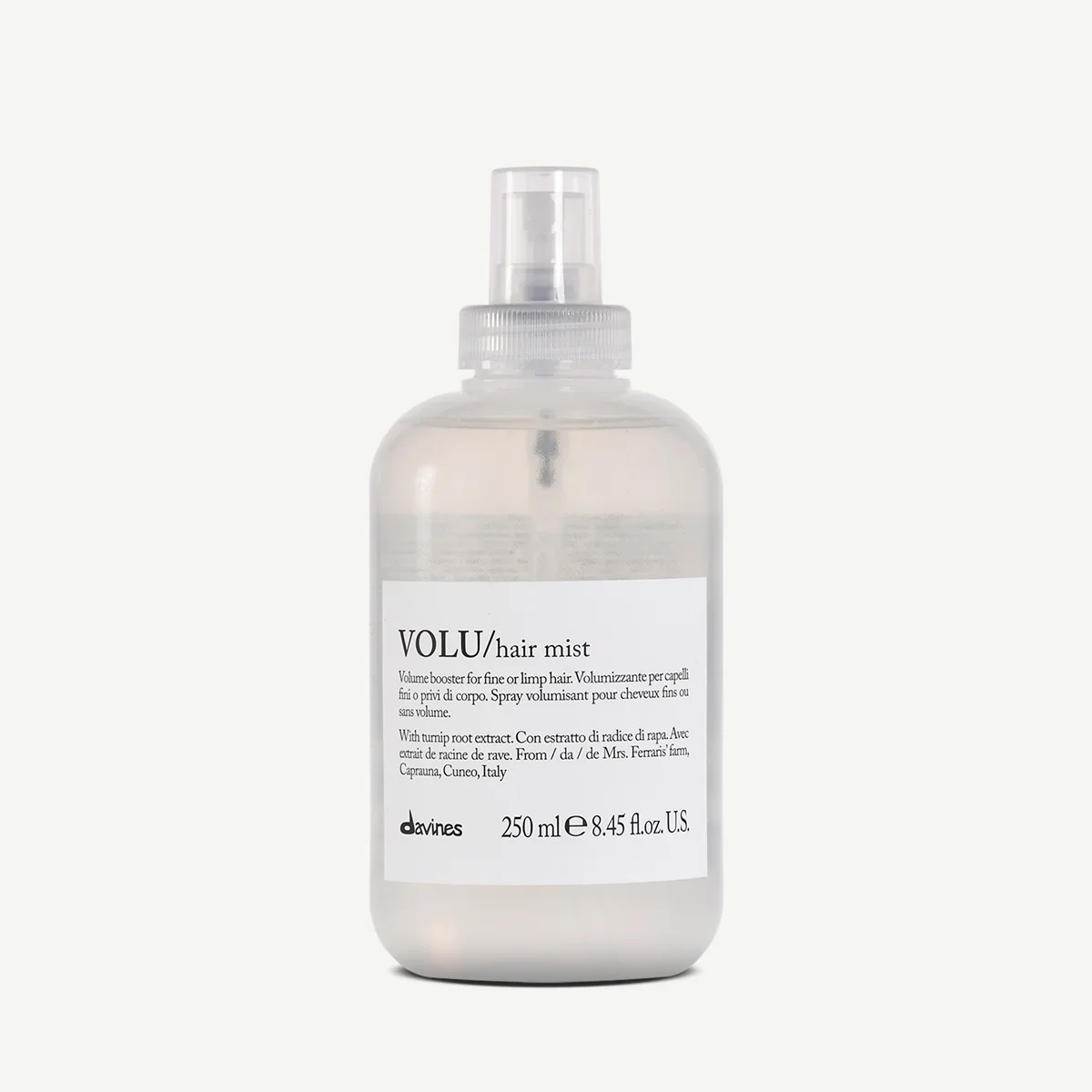 A clear plastic spray bottle labeled 'VOLU/hair mist' by Davines, containing 250 ml of hair volume spray with extract from turnip root, on a plain white background.