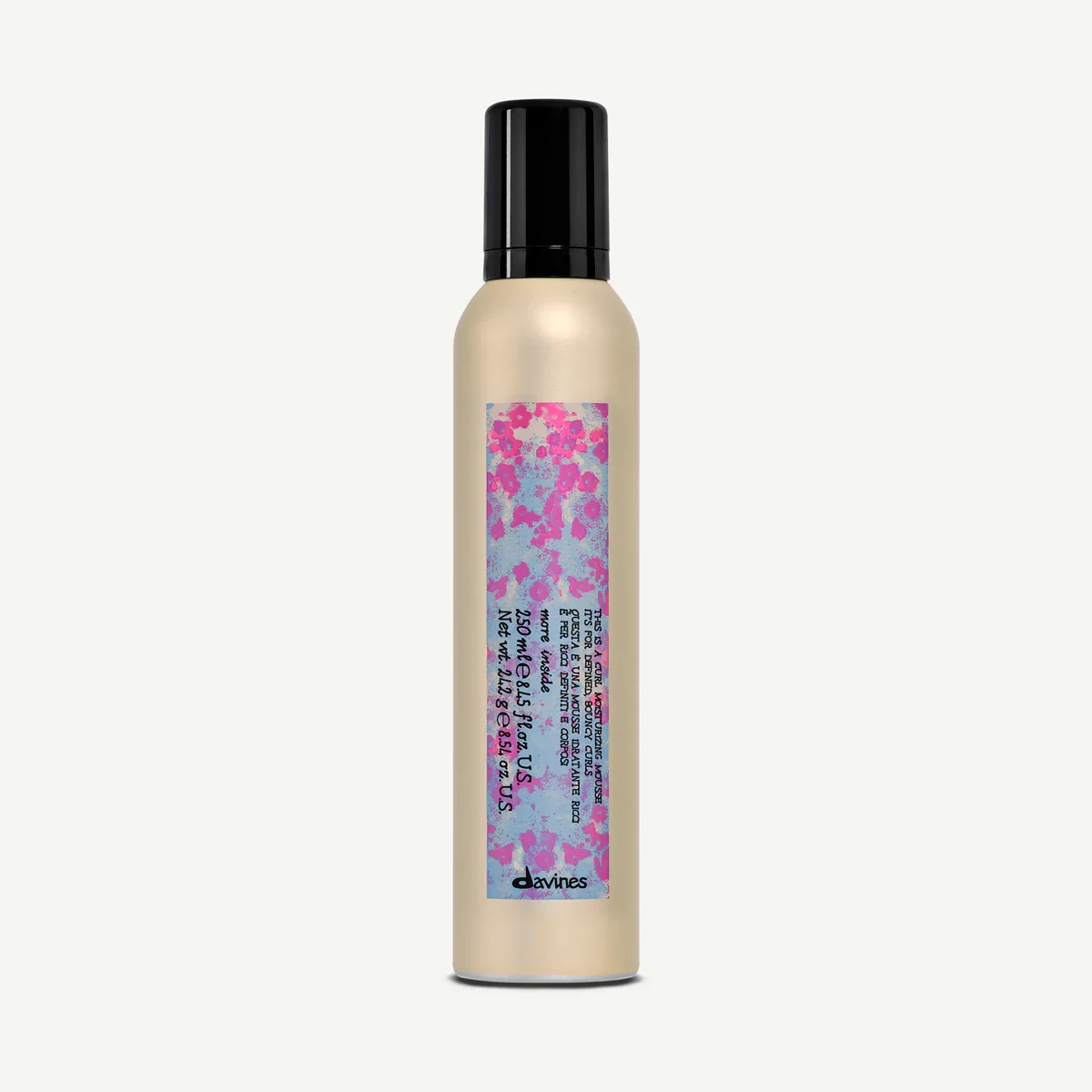 A beige spray bottle with a black cap, featuring a label with pink, blue, and purple abstract patterns and text, including the brand name 'davines' at the bottom.