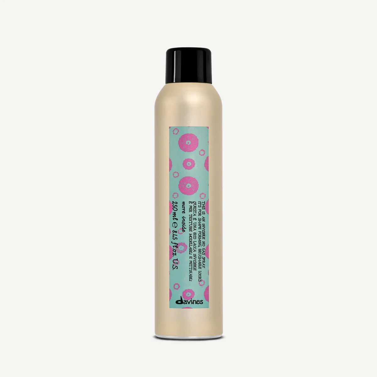 A beige aerosol spray bottle with a black cap, featuring a label with pink donuts on a light blue background and text.