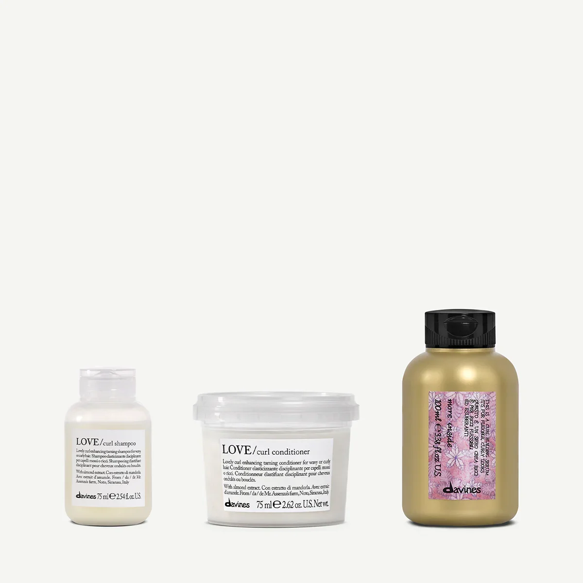 Three hair care products: Love curl shampoo, Love curl conditioner, and a Davines hair product with pink label, on a plain background.