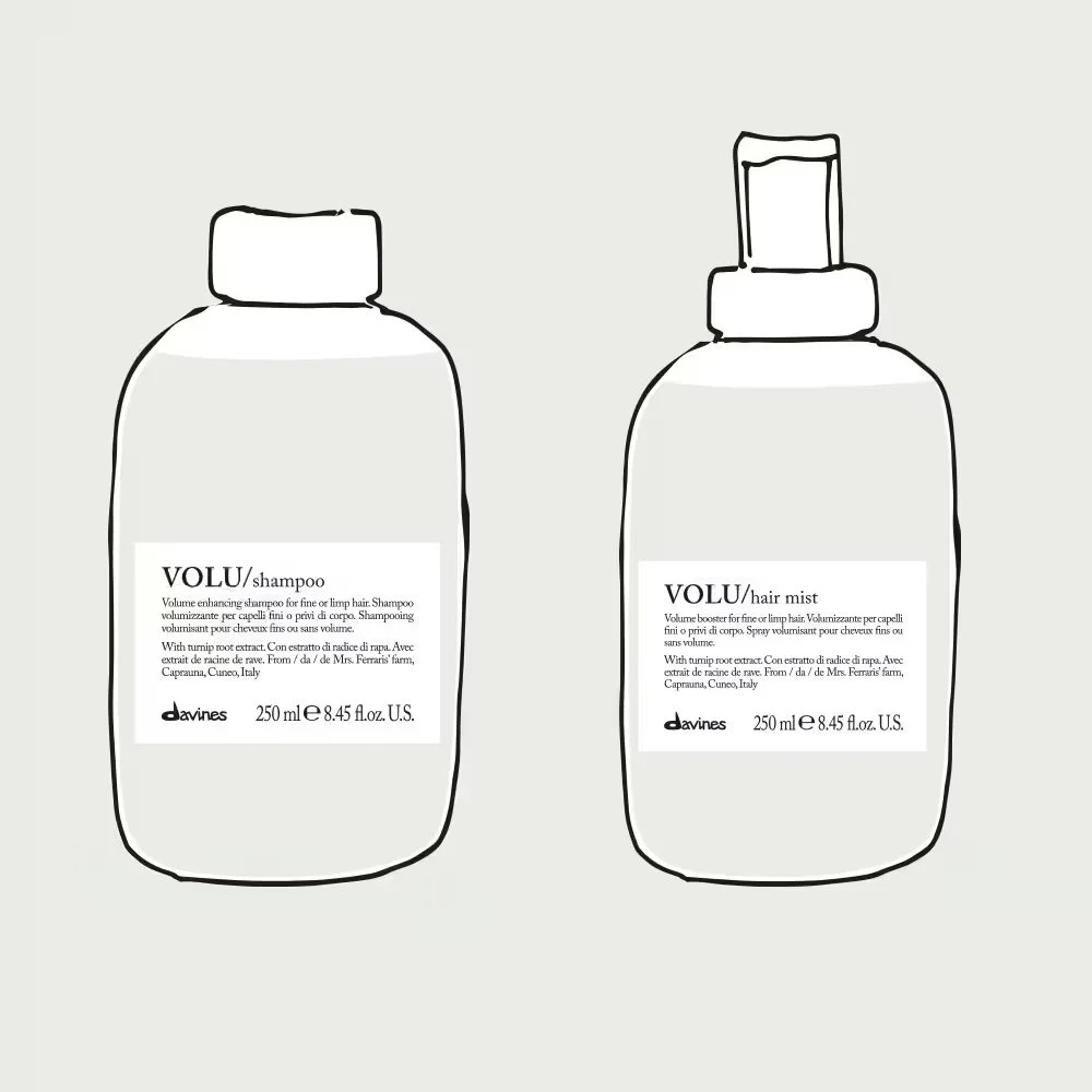 Line drawing of two bottles of hair care products, one shampoo and one hair mist, with white labels and black text, set against a light gray background.