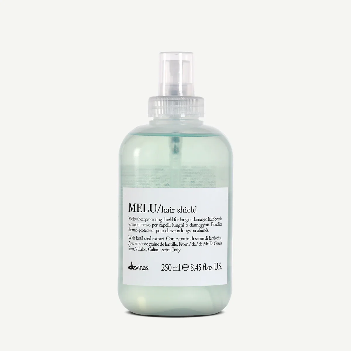 A clear plastic spray bottle labeled MELU hair shield with liquid inside, designed for protecting long or damaged hair, containing 250 ml of product from Davines.