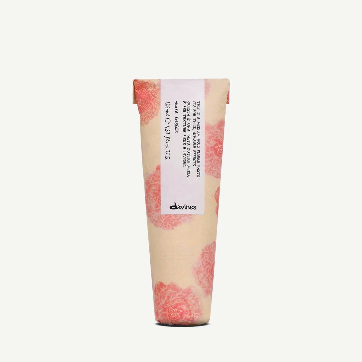 A tube of skincare product with pink and white floral pattern on the packaging, featuring a white label with black text and the brand name 'davines' at the bottom.
