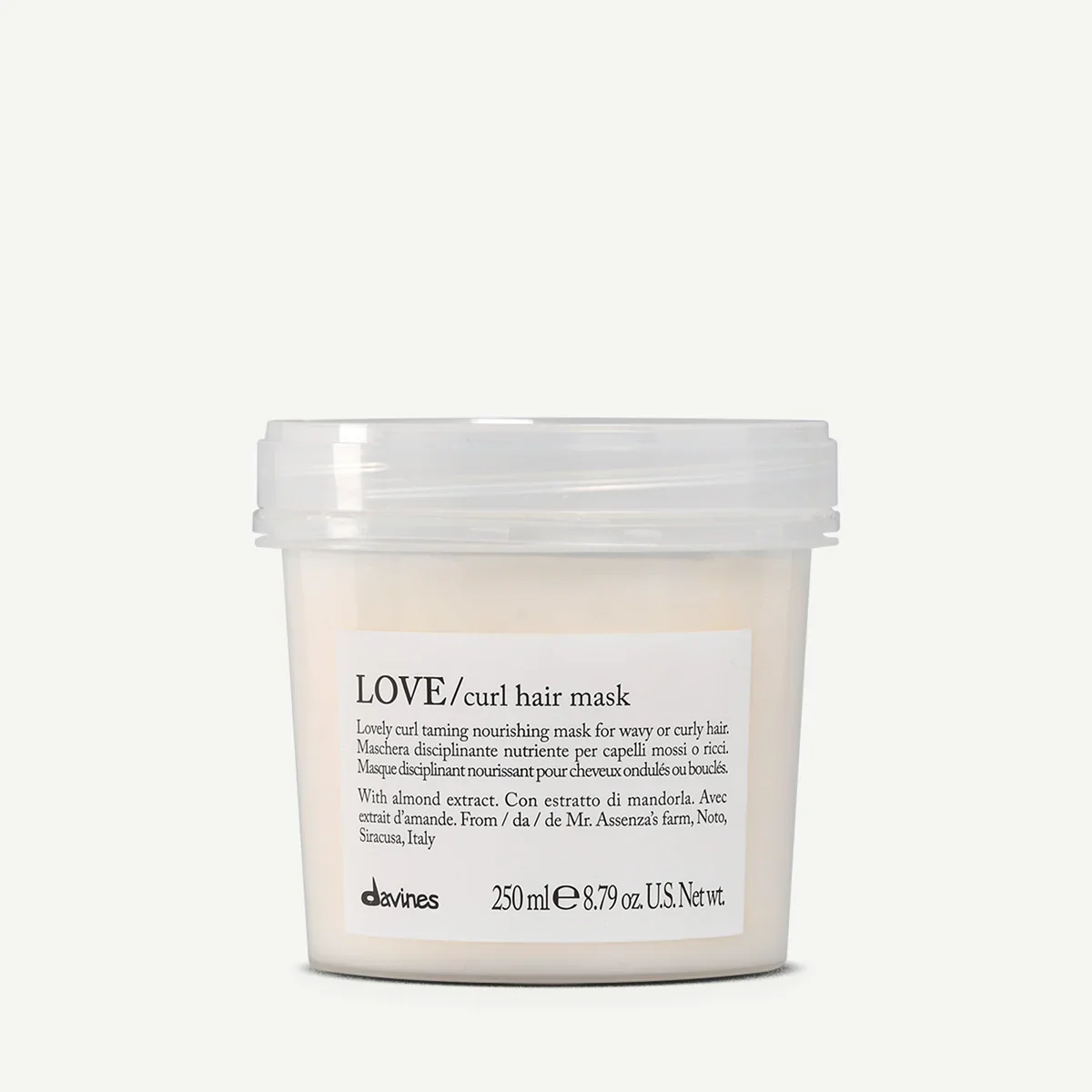 Container of Davines Love curl hair mask with white label and clear plastic lid.