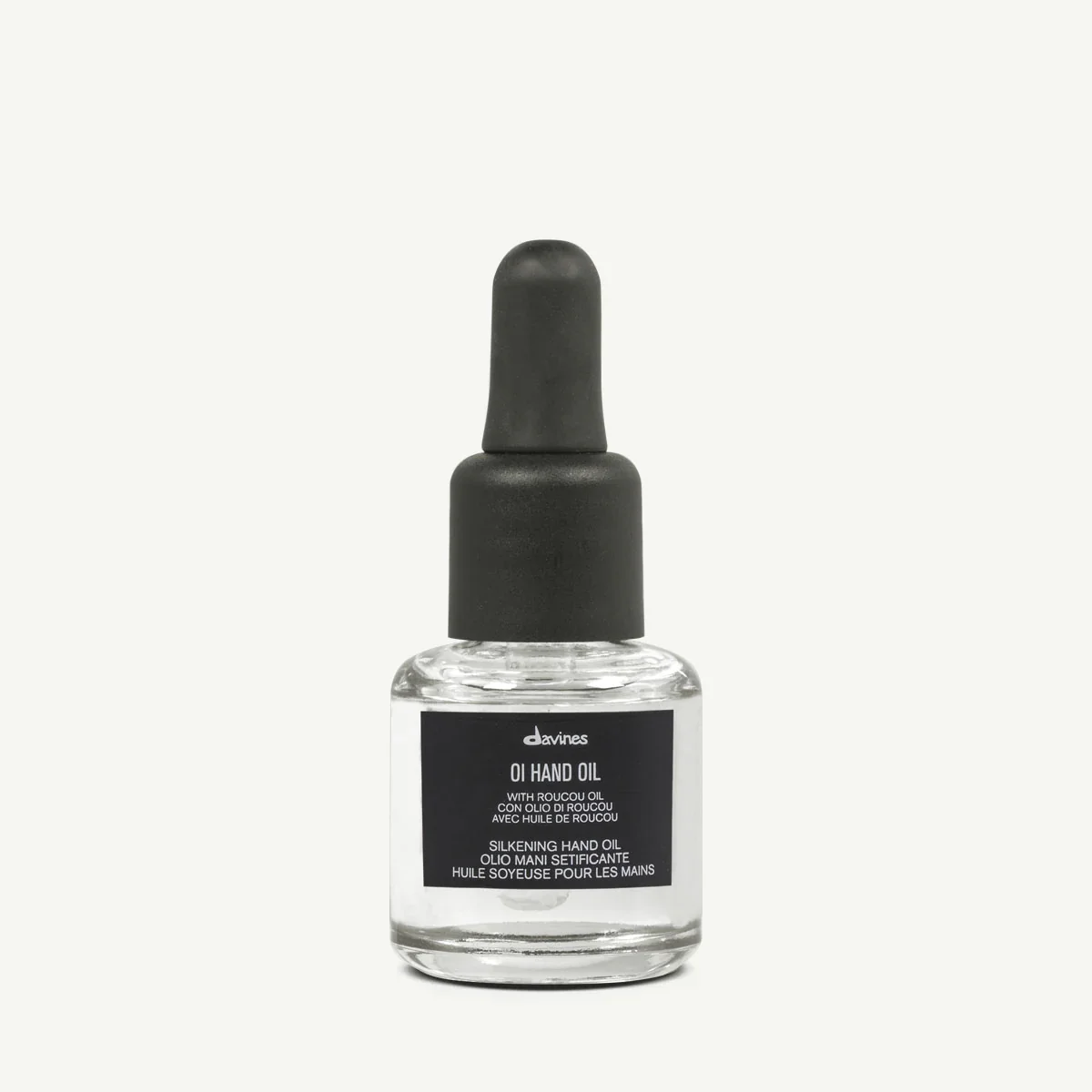 A clear glass bottle of Davines OI Hand Oil with a black dropper cap and black label on a plain white background.