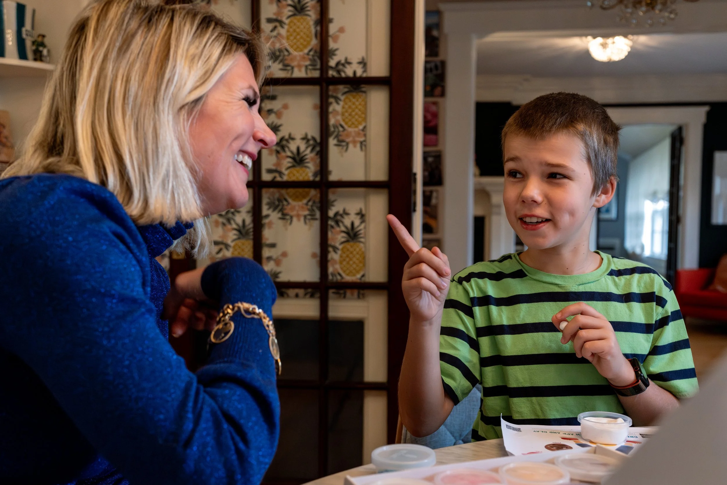 documentary family photography mother and son laughing in conversation