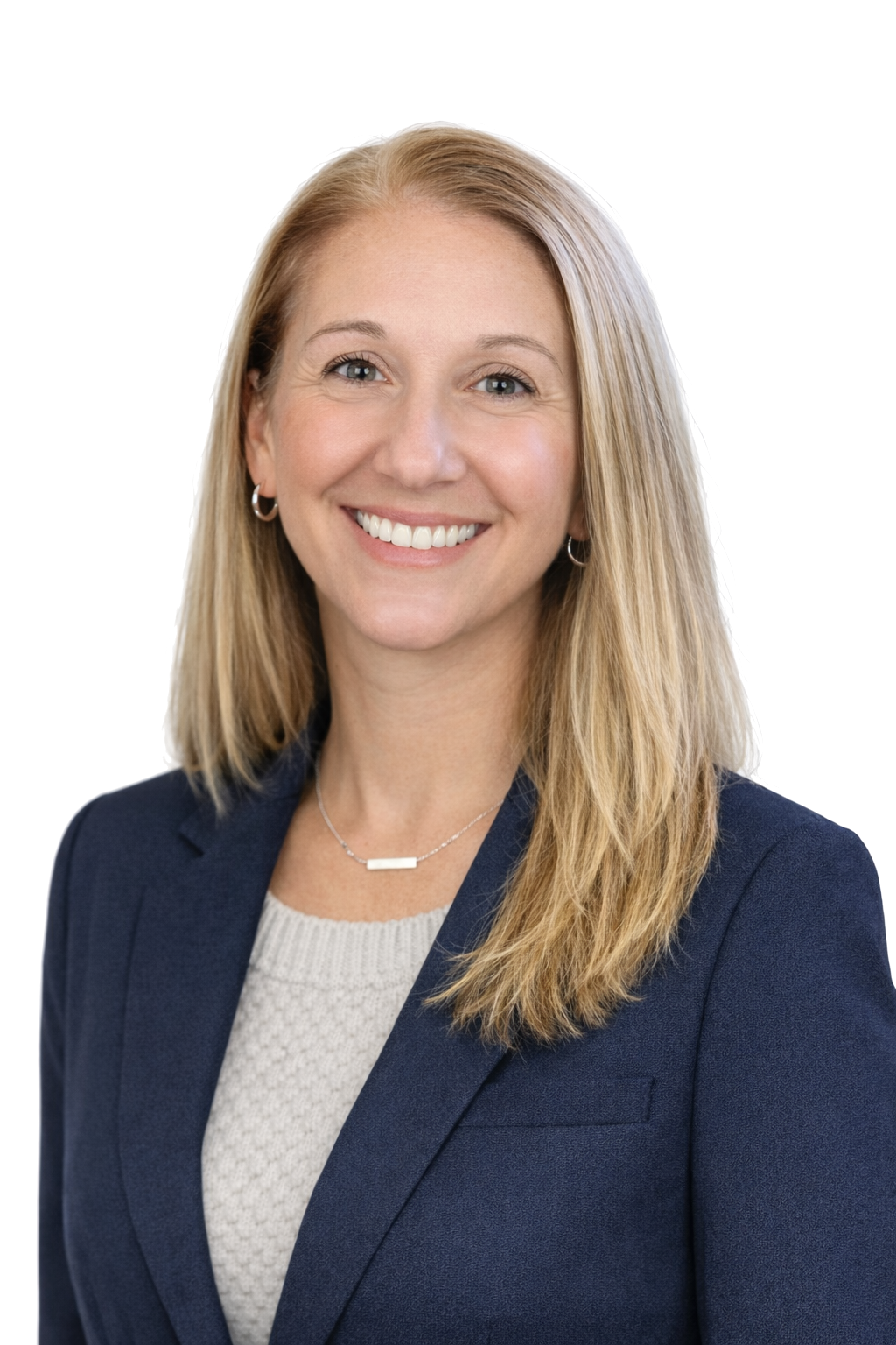 Smiling woman with long blond hair wearing a black top and a necklace on a white background.