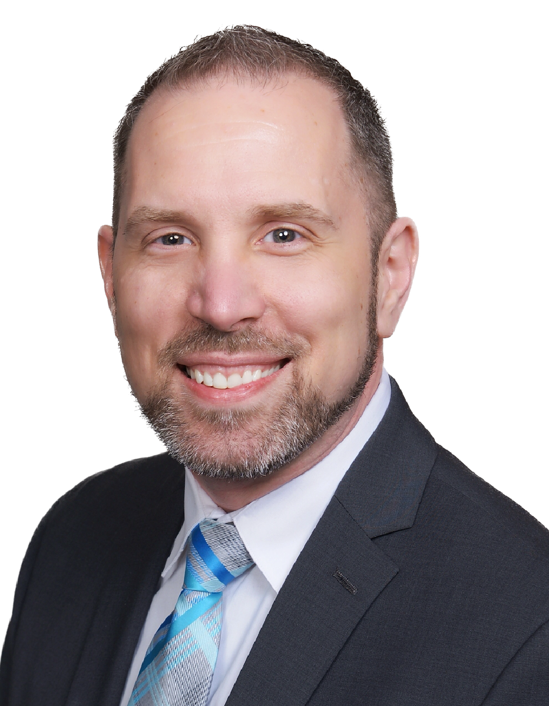 Man in a suit with a blue tie smiling
