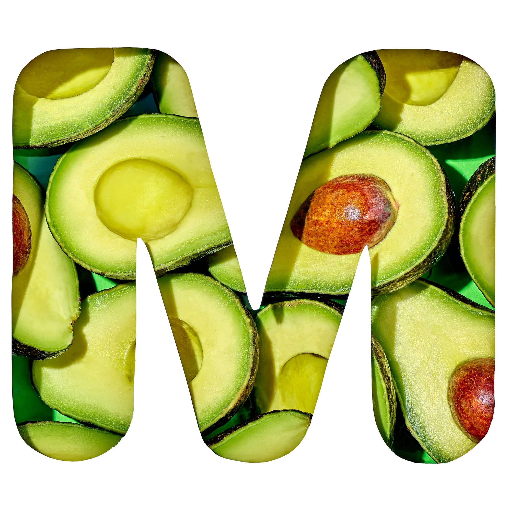 The letter M filled with halved avocados and their pits, part of Suzanne Clements' produce-spelled SUMMER title card for the Publix summer campaign.