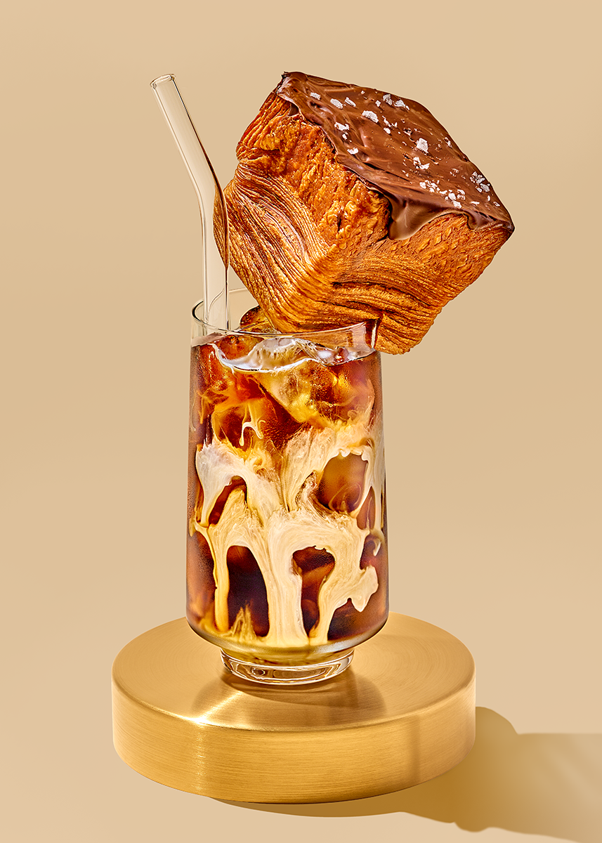 Generous cold brew coffee beverage photography with a perfect French croissant as a garnish. Photographed by photographer and director Suzanne Clements.  Represented in Chicago, works in NYC, LA, Orlando, Florida, and everywhere in between.