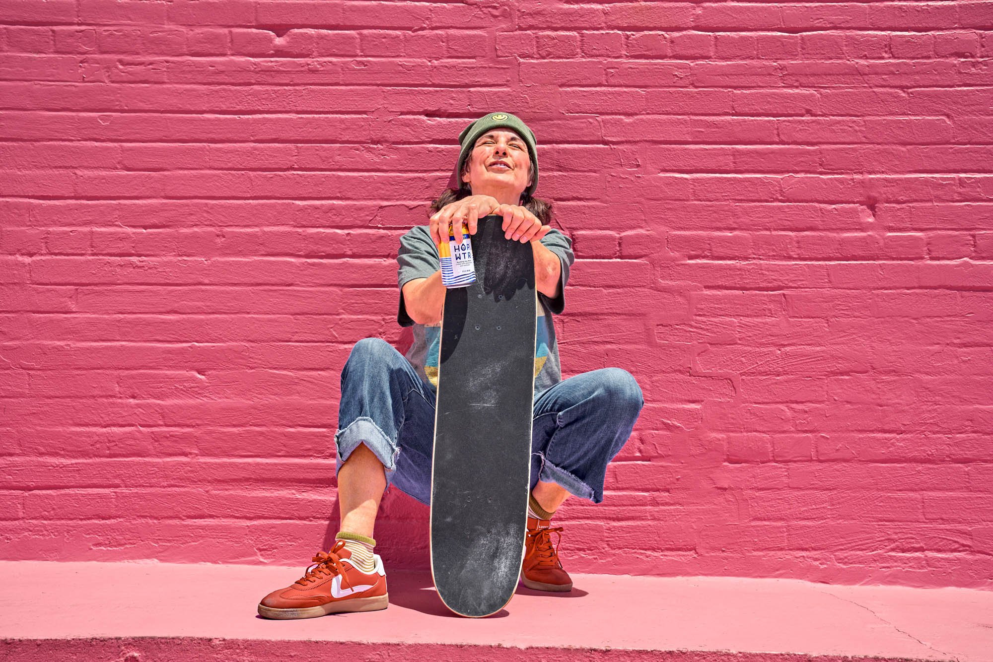 Portrait of a skater taking a break post-ride, lifestyle commercial photo shoot on location in Orlando, Florida