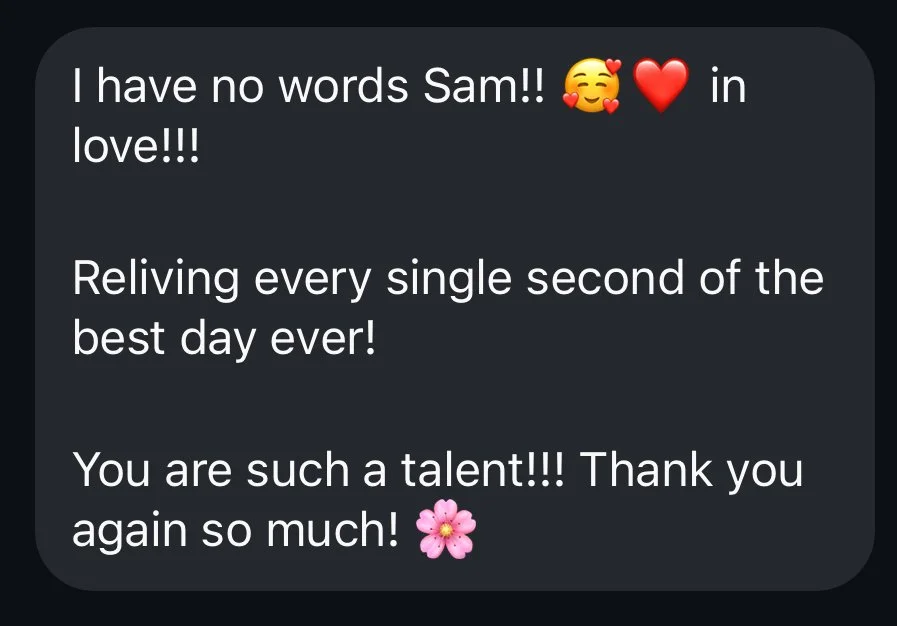 Text message expressing love and gratitude, with emojis of a smiling face with hearts, a red heart, and a pink flower.