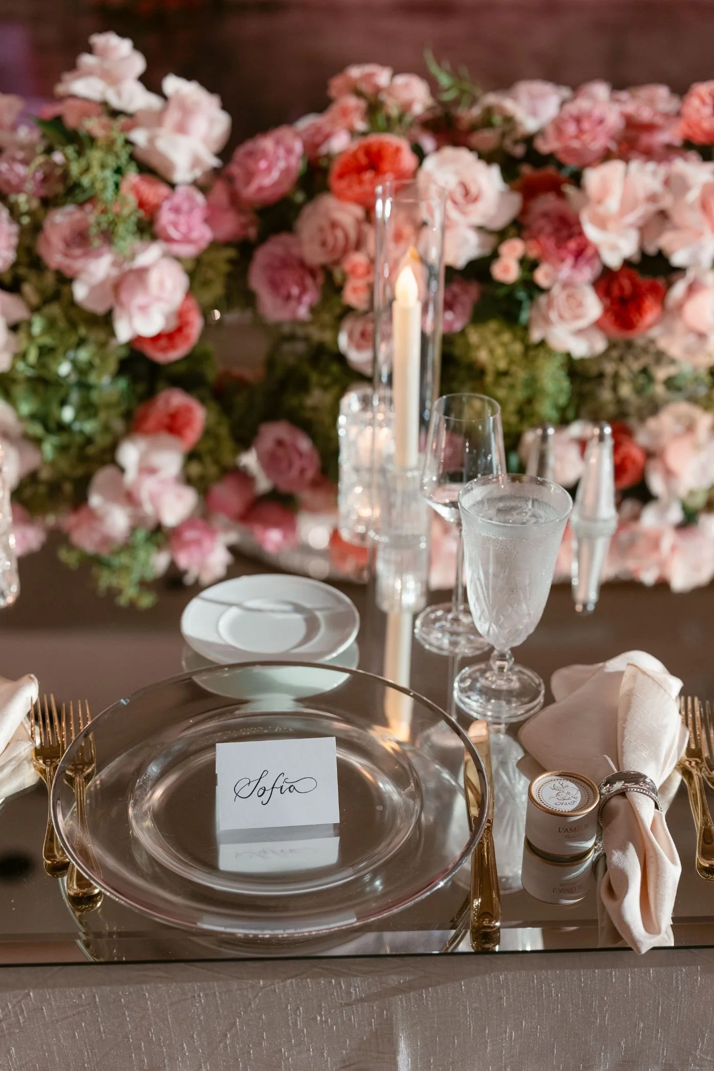 Wedding Planner and Event Design Featuring Lush Pink Floral Arrangements with Greenery Accents