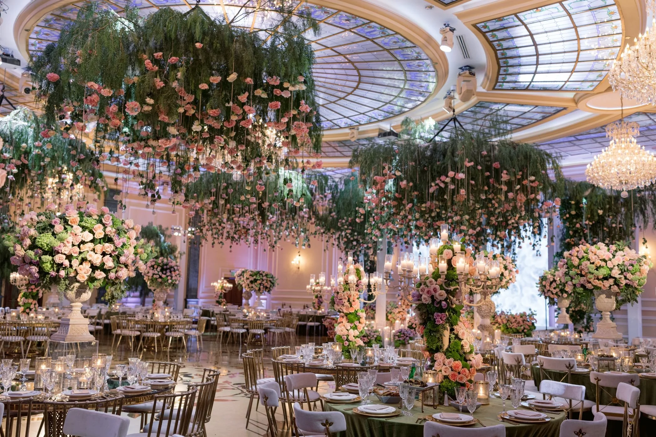 Luxury Wedding Planner Designing a Reception with a Statement Ceiling Installation and Floral Design
