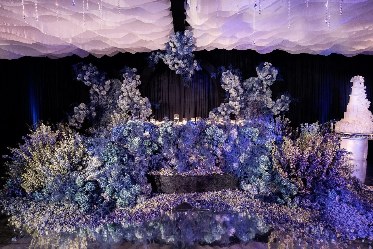 Wedding Hall Design with Layered Florals and Elegant Architectural Reception Details