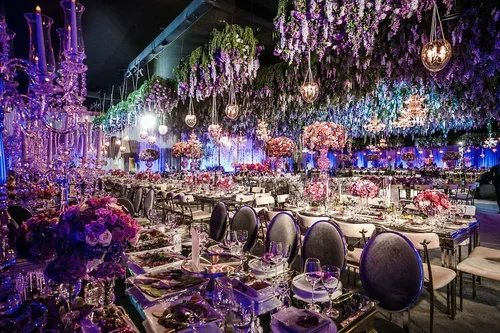 wisteria-ceiling-black-chairs.webp	Purple wedding theme reception with black chairs and wisteria ceiling