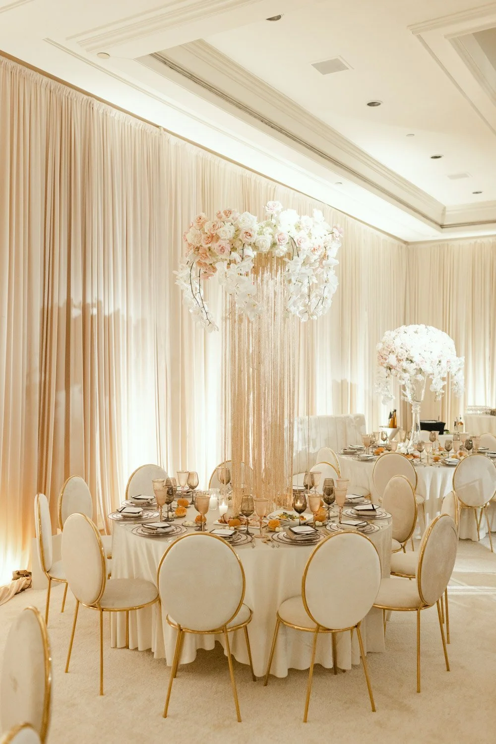 Elegant Wedding Centerpiece Design with Layered Florals and Glass Candlelight
