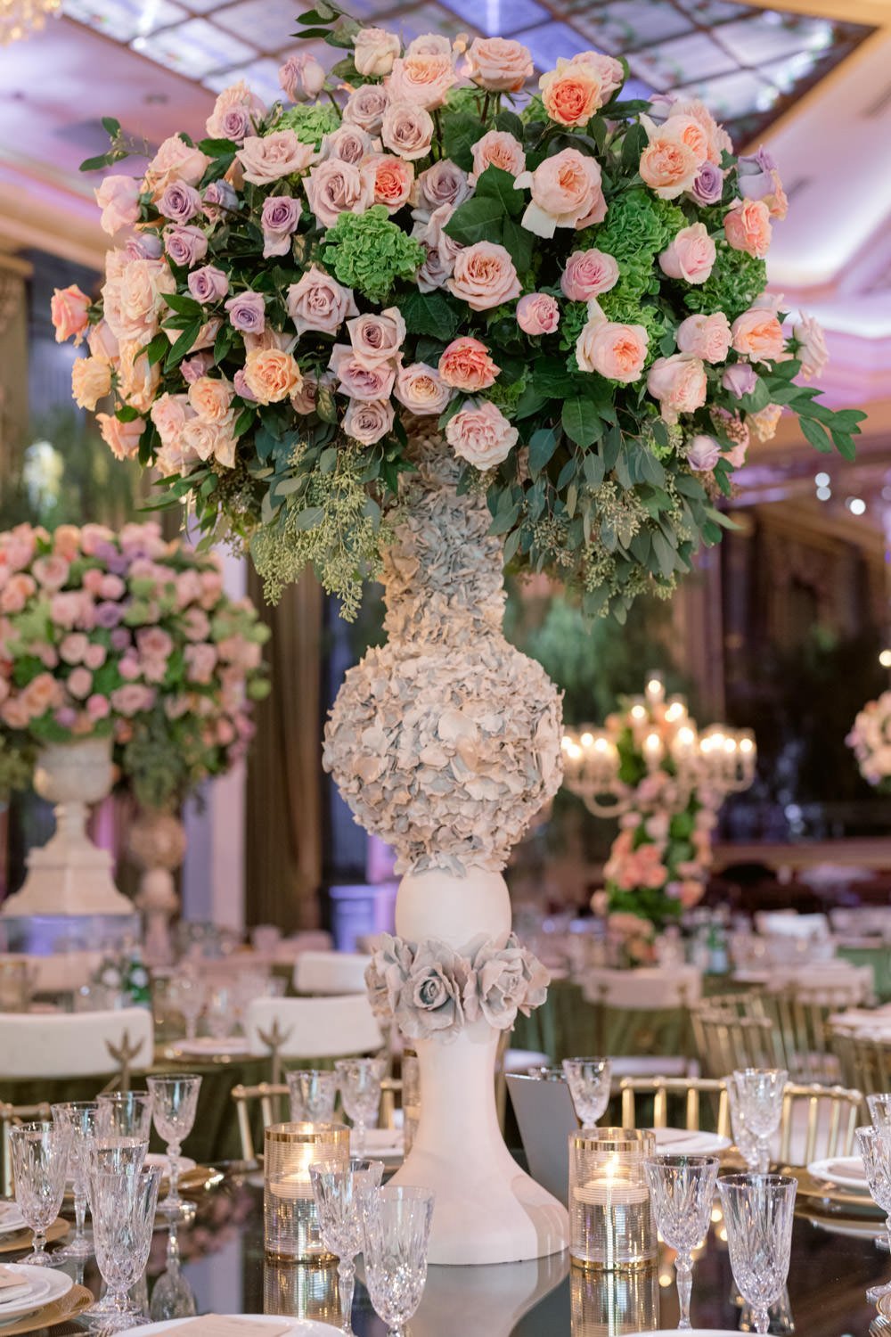 Tall deep pink and cream roses centerpieces centered around gold and cream table settings to create an enchanted garden at the Taglyan Cultural Complex - Eddie Zaratsian Lifestyle &amp; Design