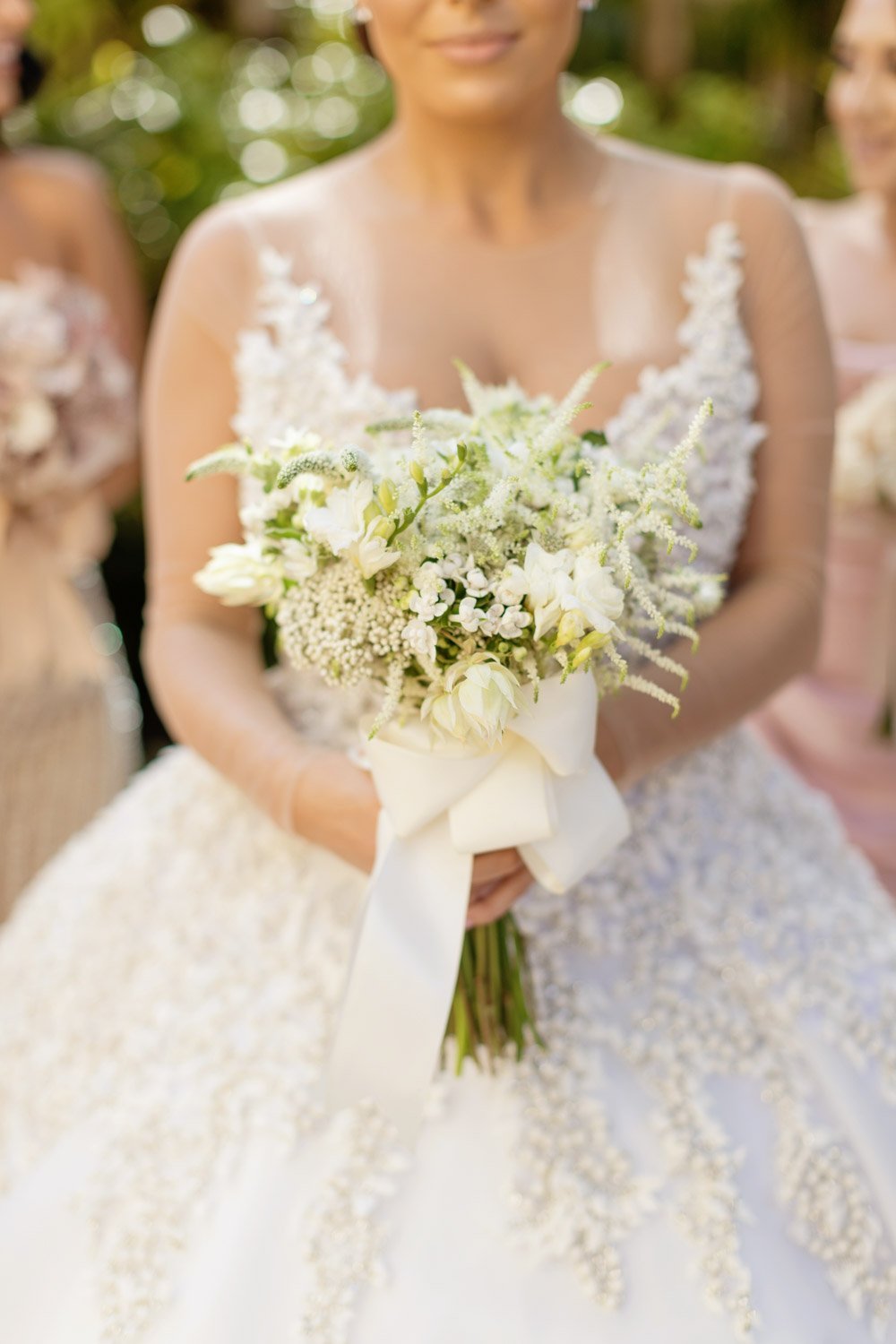 Creamy white flowers create a beautiful bridal bouquet
