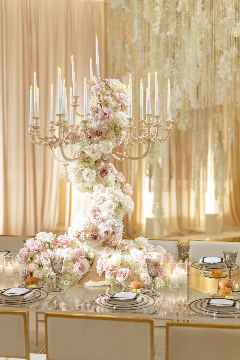 Pale pink and cream rose tall table centerpieces highlight candlelit crystal and gold accents at the Ritz-Carlton Laguna Niguel