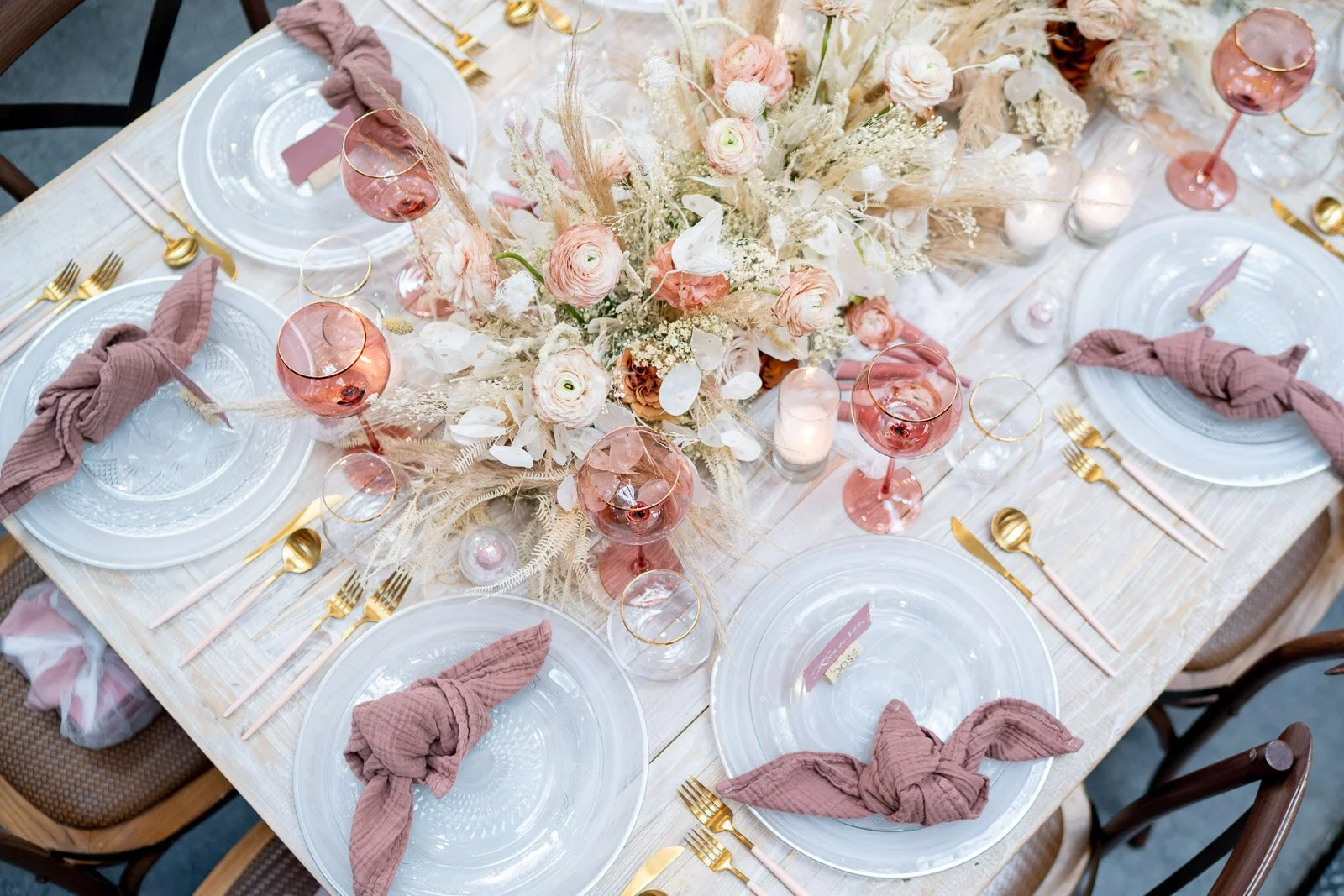 Floral arrangements with pampas grass and dried botanicals in a neutral, nude and pink color palette. Designed by Eddie Zaratsian, photo by Kamera Productions.