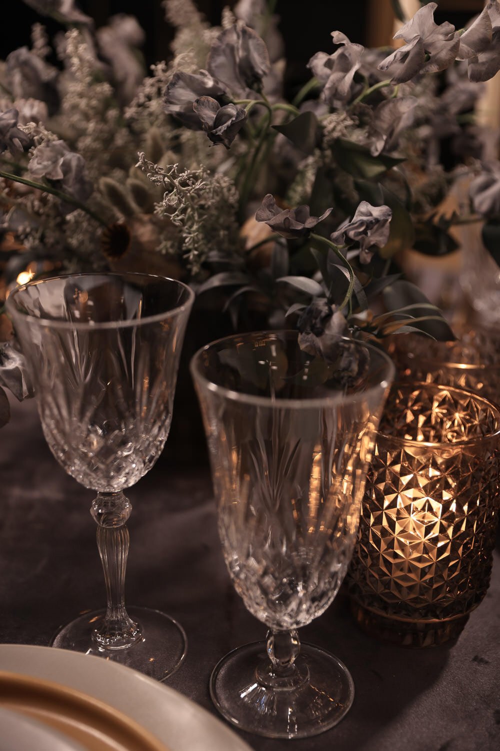Grey velvet tablecloth with monochromatic place settings and centerpiece, designed by Eddie Zaratsian Lifestyle and Design