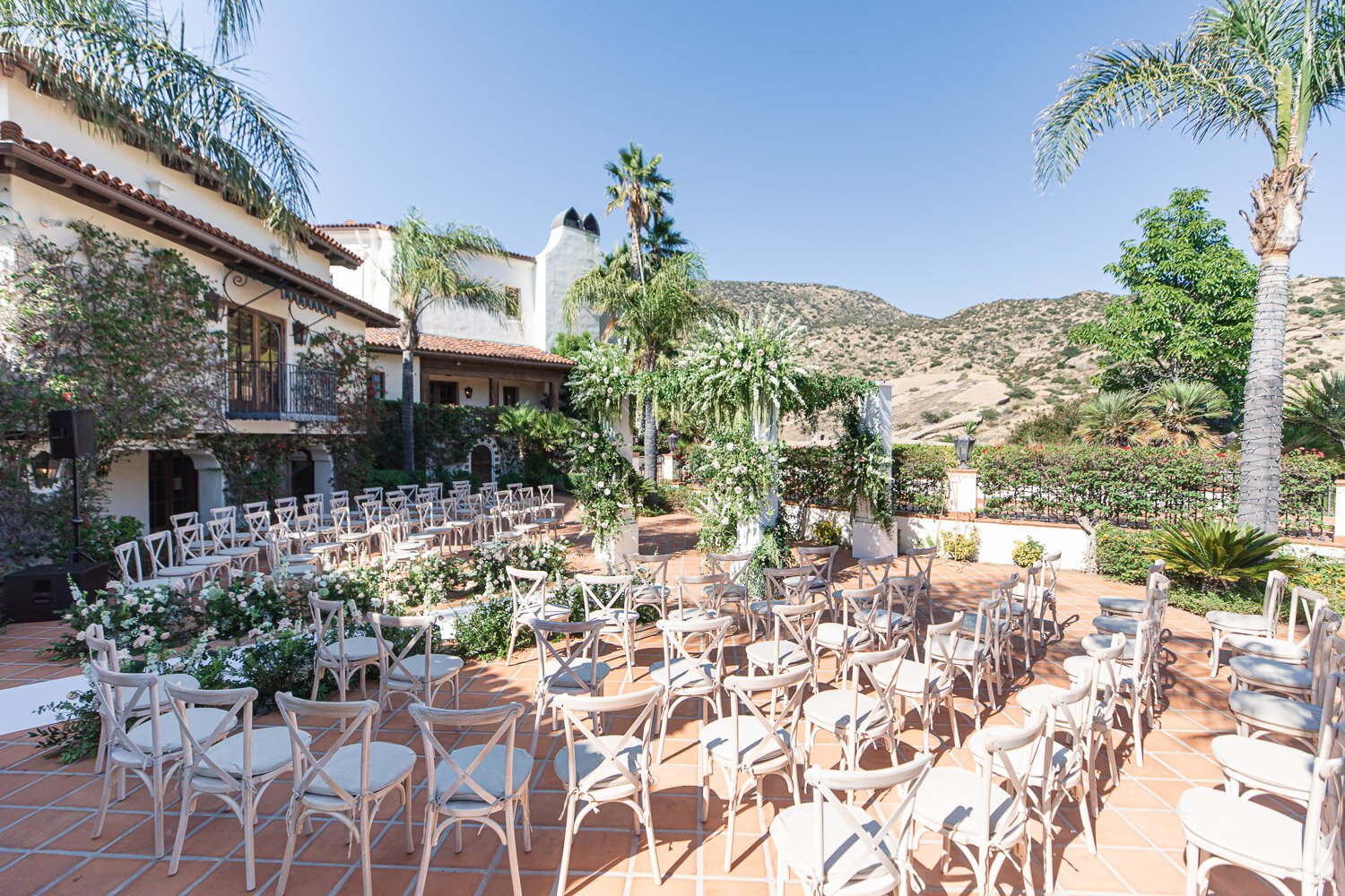 Wedding ceremony floral decor at Hummingbird Nest Ranch, designed by Eddie Zaratsian Lifestyle & Design