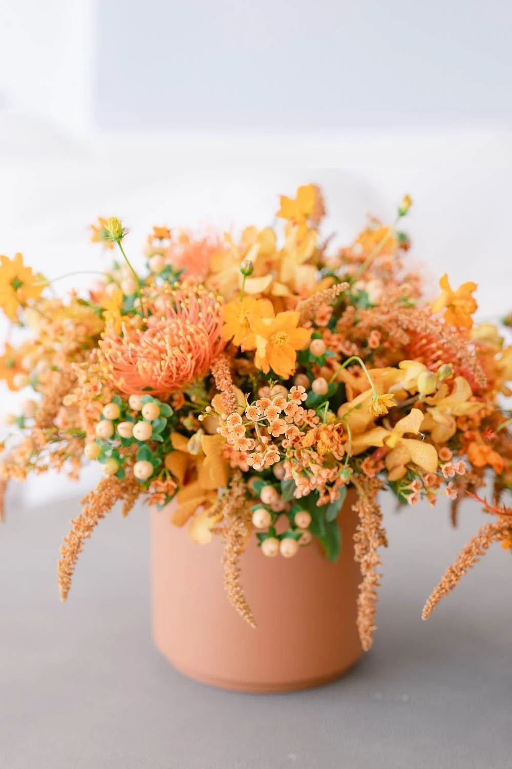 Orange flower arrangement designed by LA florist Eddie Zaratsian