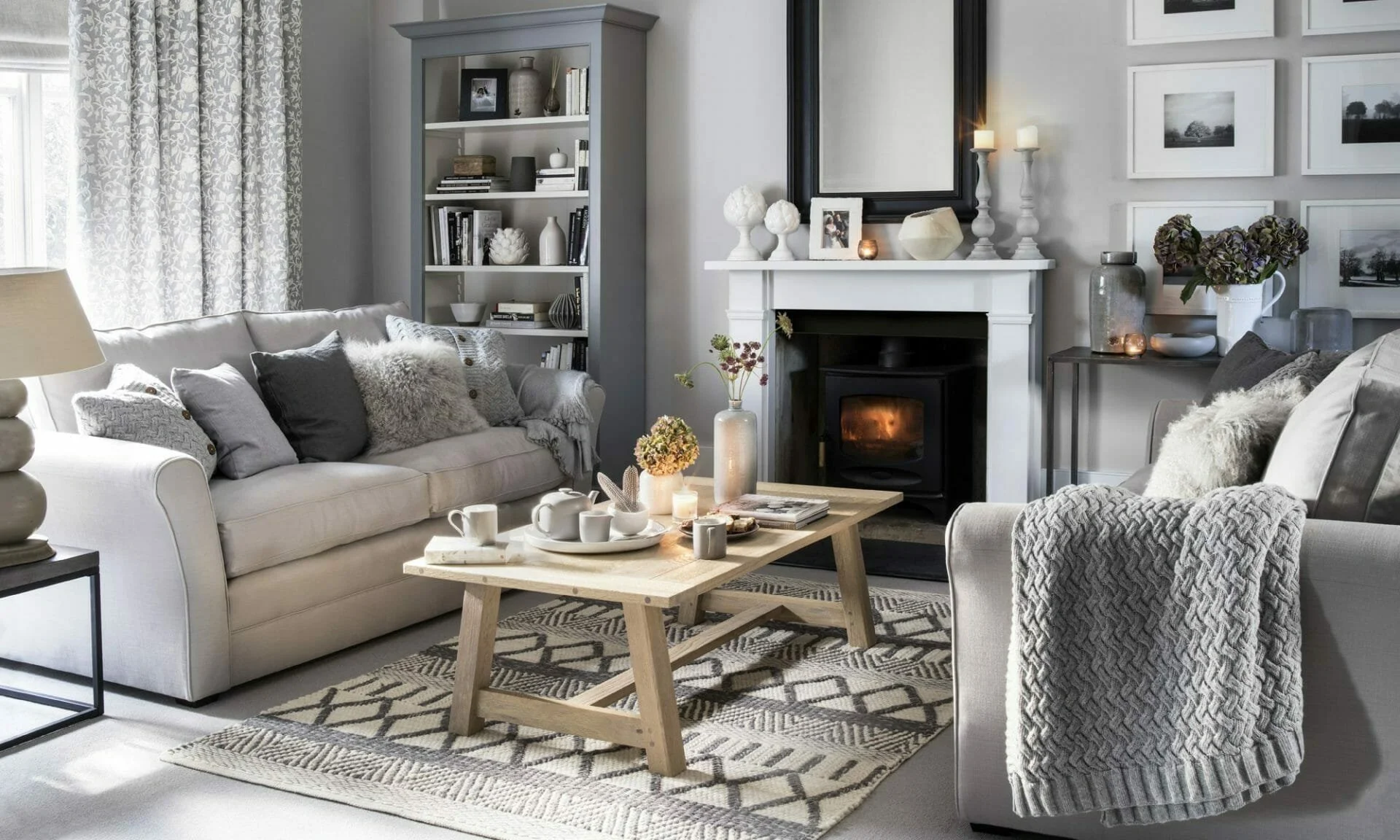 Neutral winter home decor with ceramics and soft textures in a cozy hygge interior design
