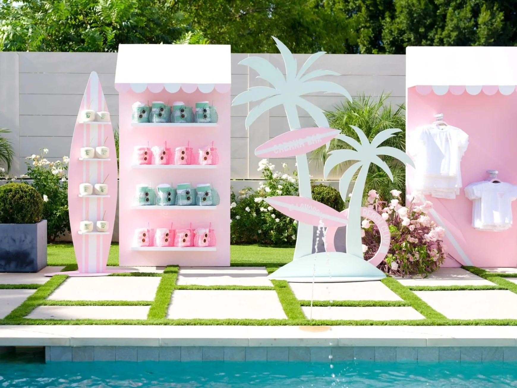 Gift stations at a 1st birthday pool party designed by LA event designer and planner Eddie Zaratsian 