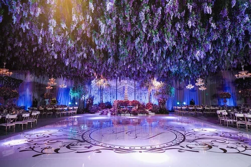 Crystal candelabras as part of a plum wedding colors tablescape design