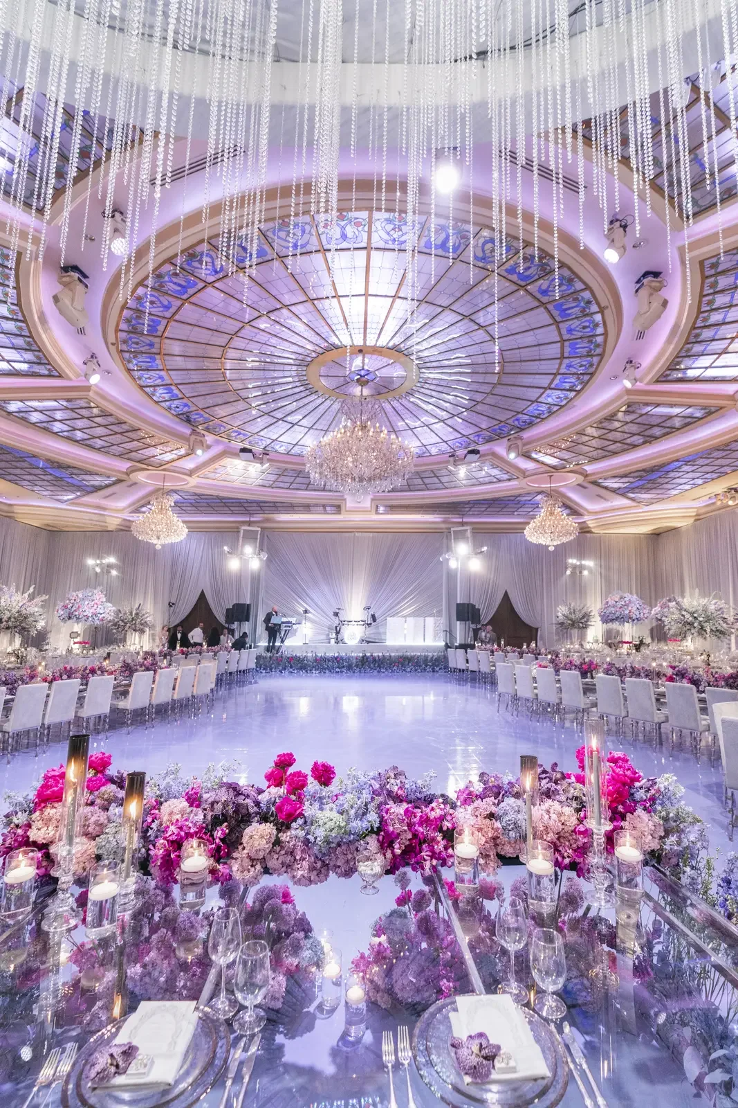 Purple wedding colors reception with crystal dome ceiling and dance floor