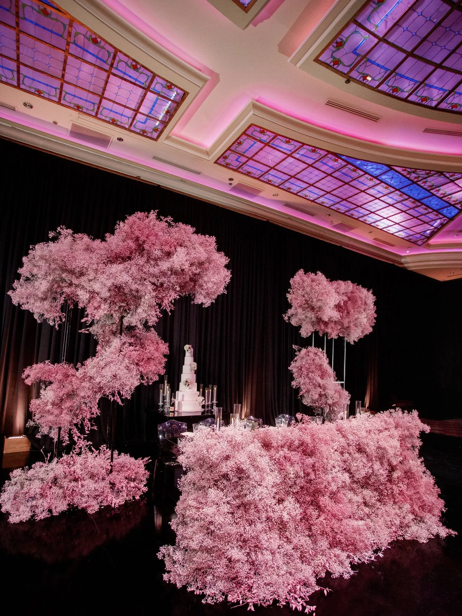 Wedding Planner Designing a Striking Wedding Reception with Sculptural Florals and Moody Design