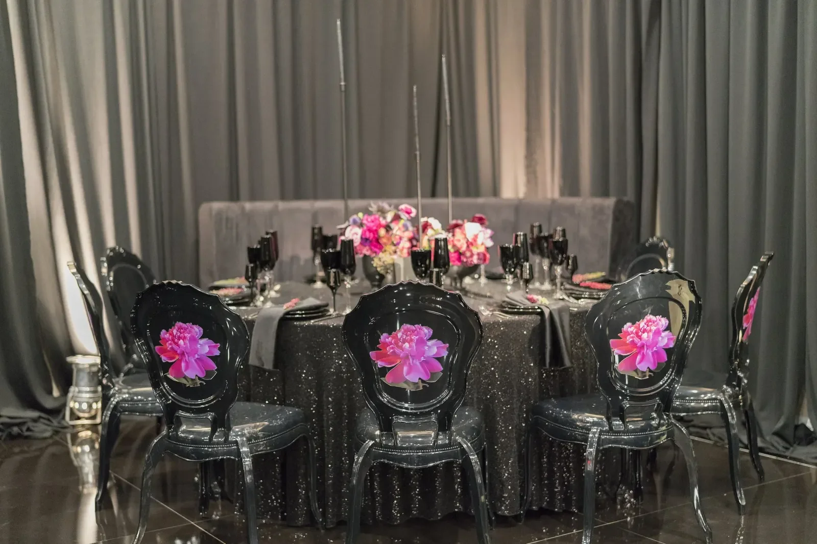 Sweet 16 birthday party planner design with a black sequin tablescape, pink peony centerpieces, and clear ghost chairs