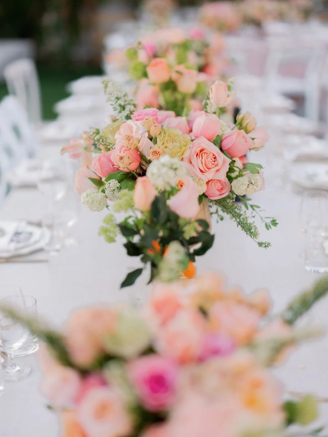 Elegant Garden Wedding Reception with Open-Air Design and Layered Table Details