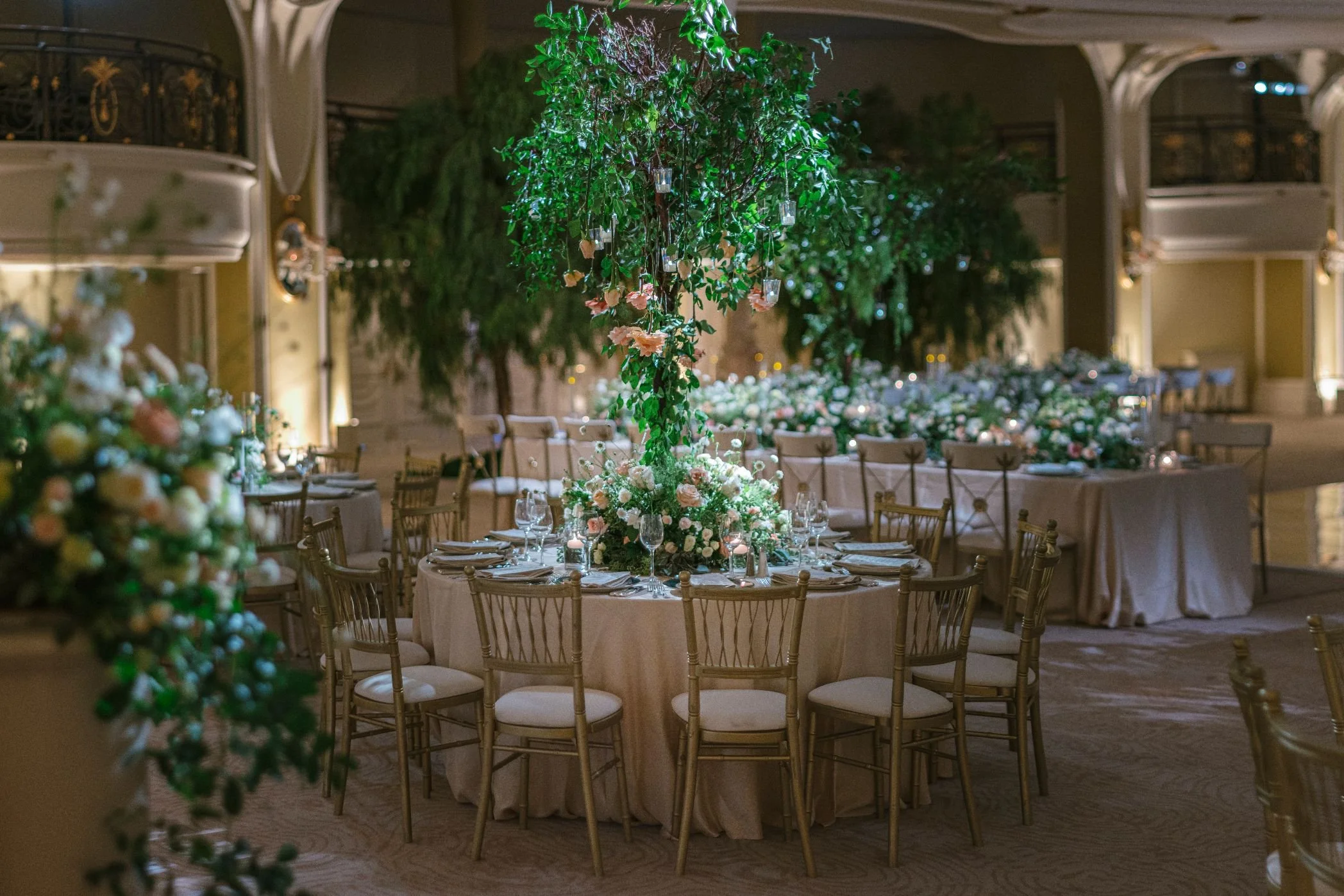 Tree-Inspired Centerpieces with Cascading Greenery Creating an Enchanted Forest Wedding Setting