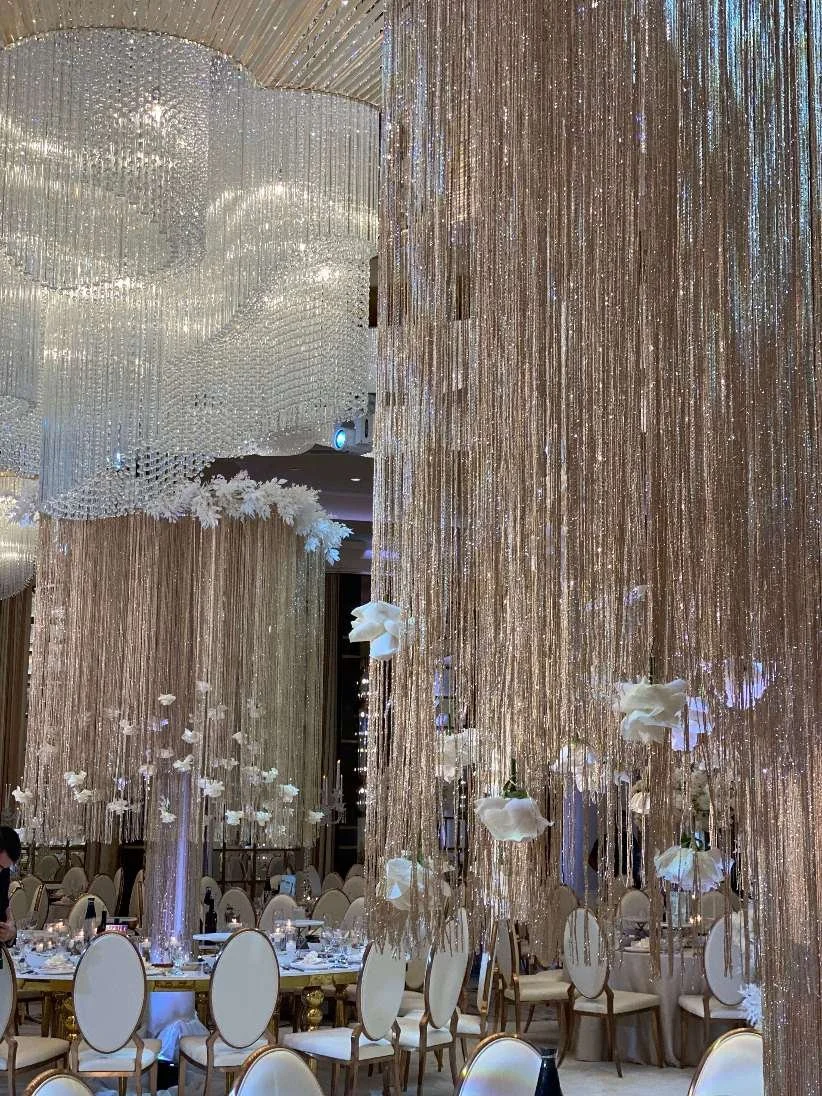 Hanging Crystal Installation with Layered White Florals Creating a Luxury Wedding Ceiling Design