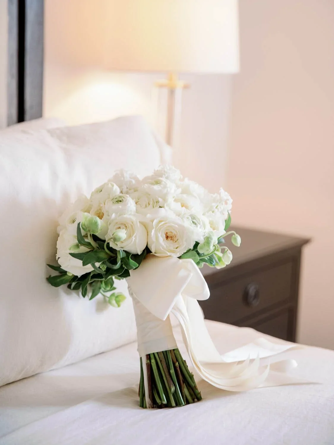 White bridal bouquet designed by Eddie Zaratsian featuring garden roses and layered textures inspired by Pantone Color of the Year 2026 Cloud Dancer.