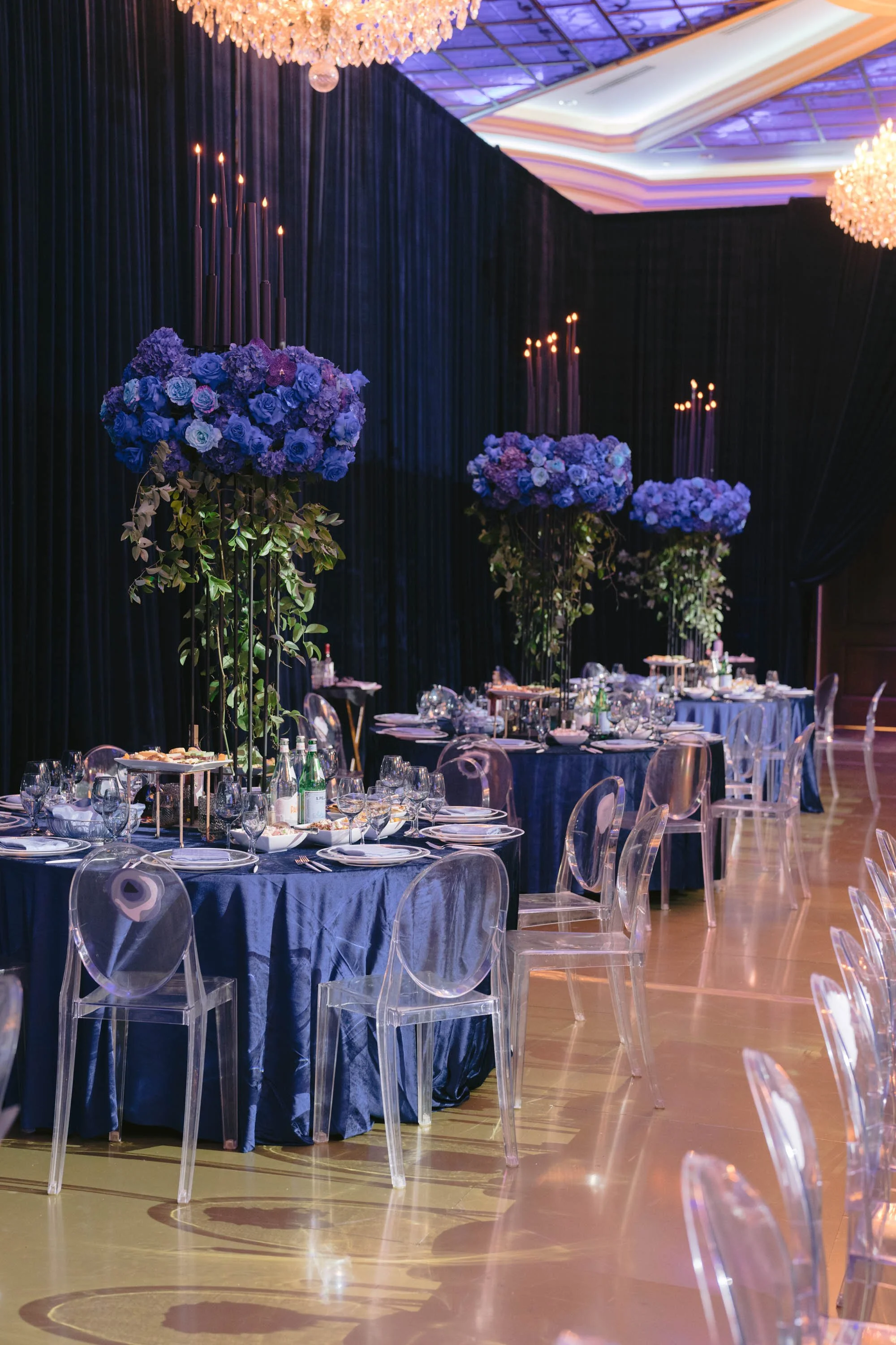 Event Planner Los Angeles Creating a Purple Birthday Party with Tall Floral Centerpieces and Elegant Guest Seating