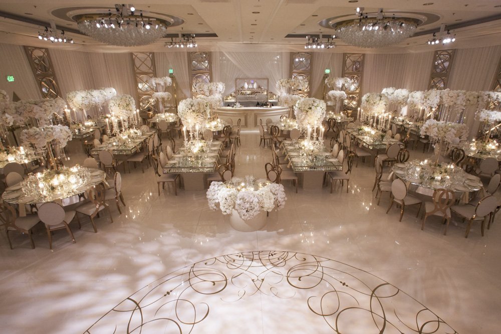 Atmospheric lighting at an elegant white, gold and cream wedding reception designed by Eddie Zaratsian Lifestyle and Design