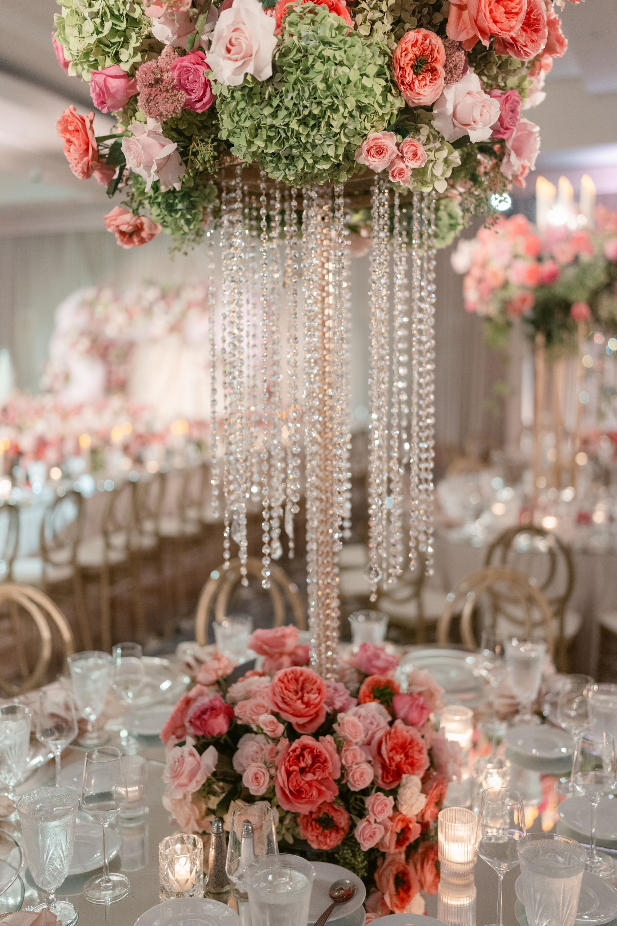 Wedding Planner Styling a Reception at the Glendale Hilton with Pink Florals and Fresh Greenery