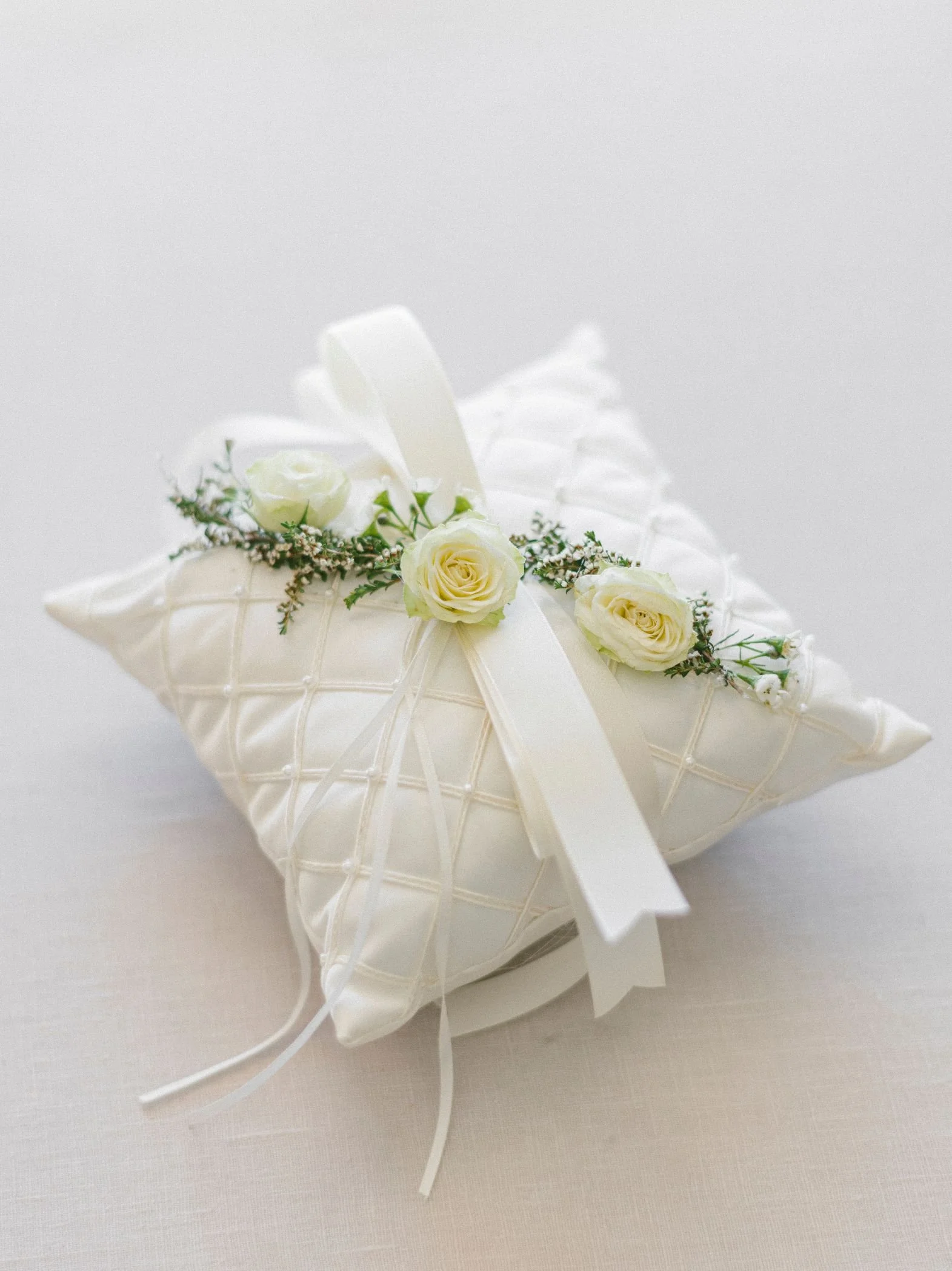 Ring Bearer Pillow with Clean White Fabric and Green Accents for a Beverly Hills Hotel Wedding