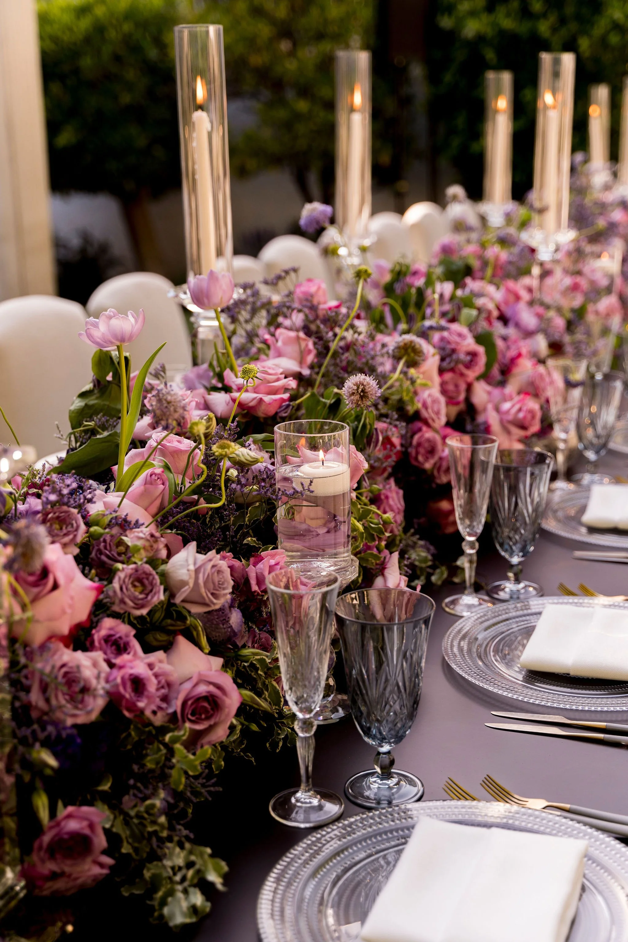 Pink and purple b'nai mitzvah floral centerpiece with garden roses and soft greenery