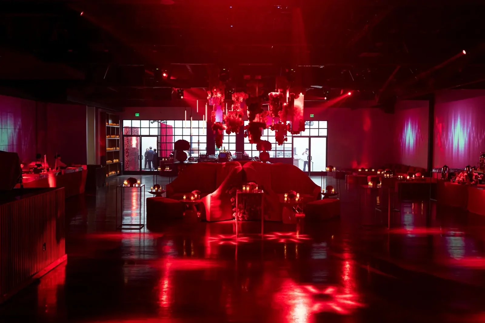Red-lit nightclub lounge area designed by a party planner for a bar mitzvah event