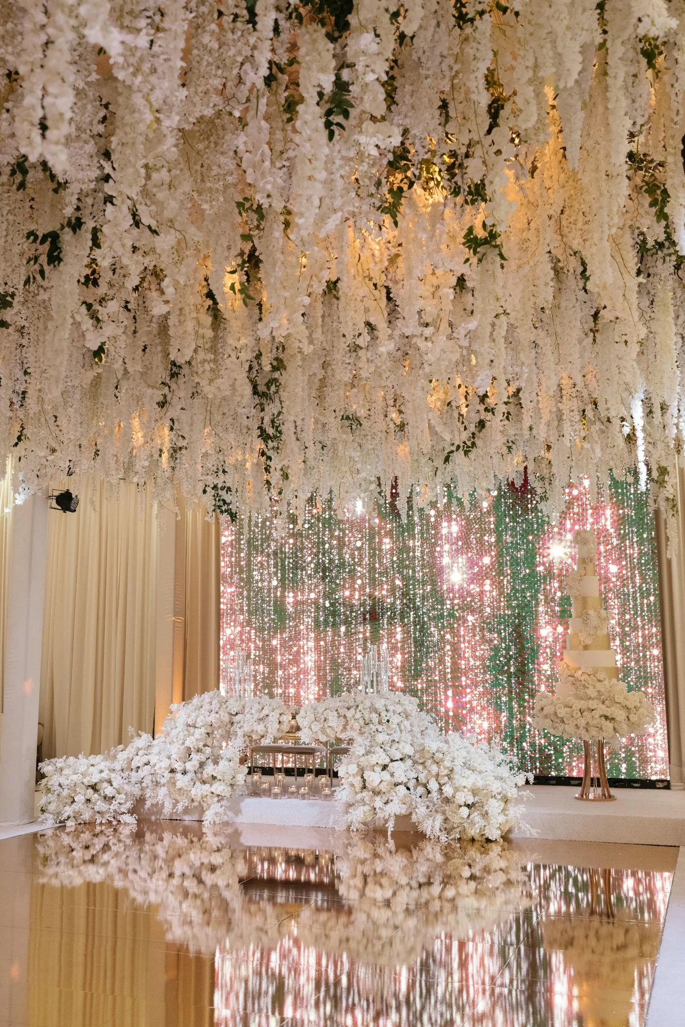 Wedding Planner and Event Design Styling a Festive Cake Display with Soft Glowing Lights