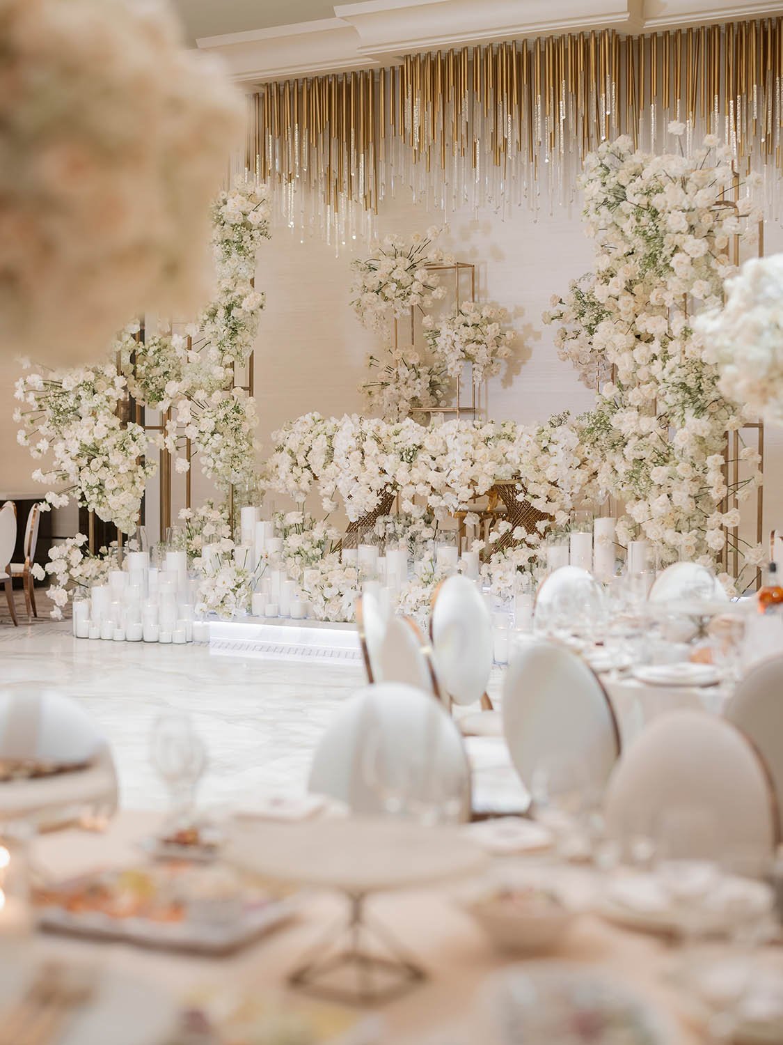 Luxurious monochromatic white, gold and cream wedding receptions design by Eddie Zaratsian Lifestyle and Design
