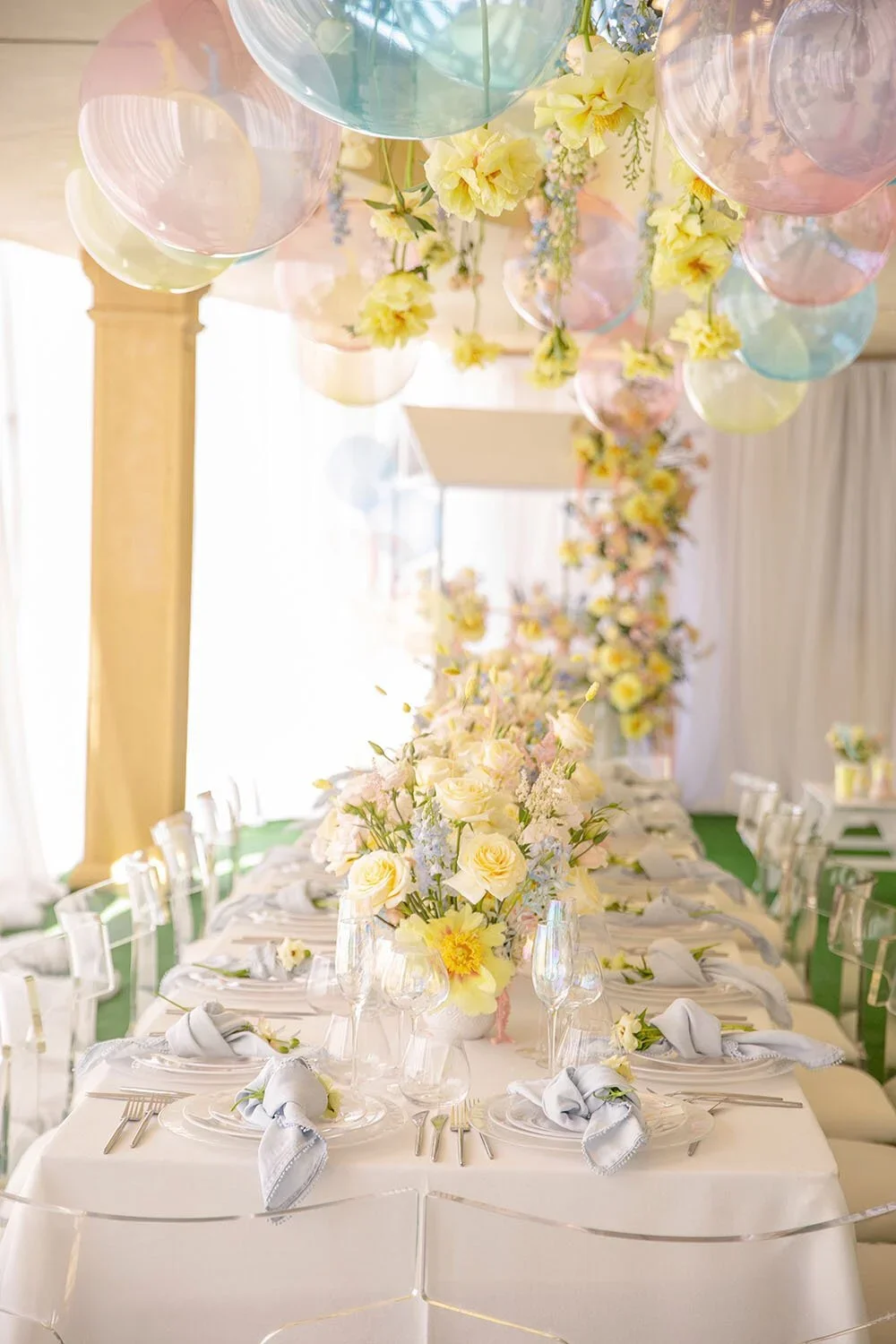 Pastel floral event design by Eddie Zaratsian featuring pink, blue, and yellow blooms layered over a Cloud Dancer white base inspired by Pantone Color of the Year 2026.
