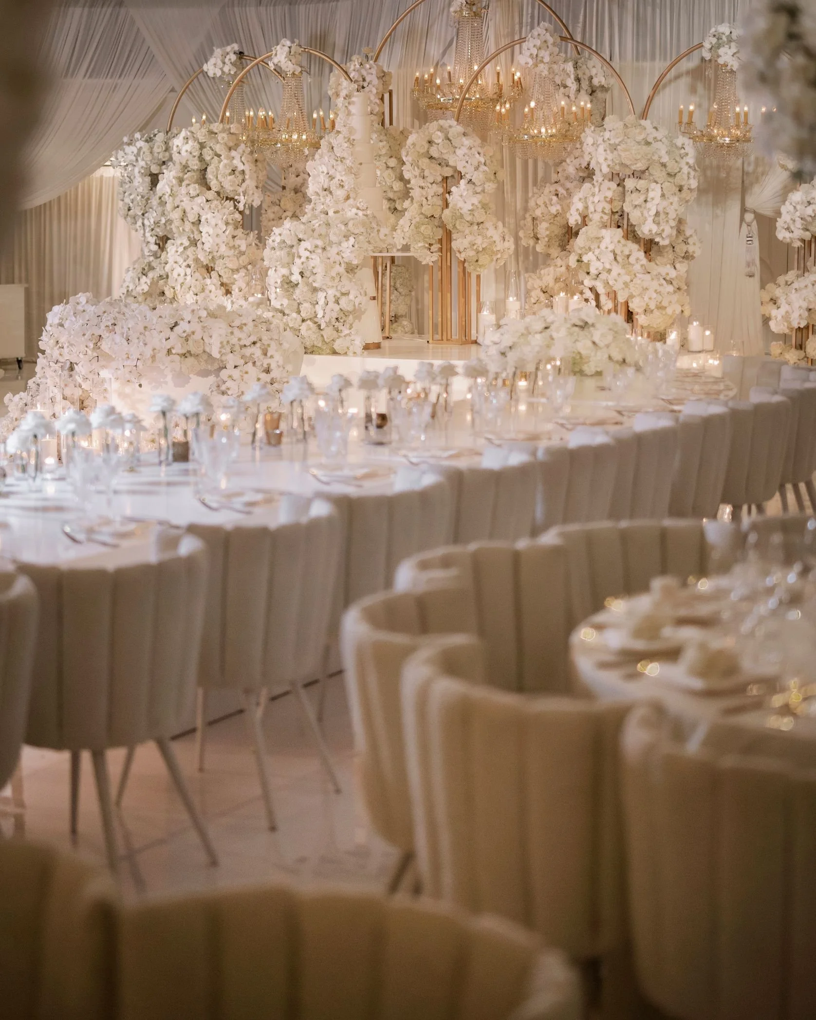 White Orchid Centerpieces Styled Across Semi-Circular Tables at a Beverly Hills Hotel Wedding